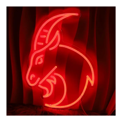 Image of Aries Neon Sign with a red neon sign featuring the Aries zodiac symbol, a ram, glowing against a dark curtain background