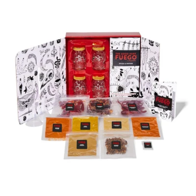 A hot sauce making kit from Fuego with a red box containing jars, spice packets, and ingredients, designed for Aries men to create spicy and bold flavors with their creative skills.