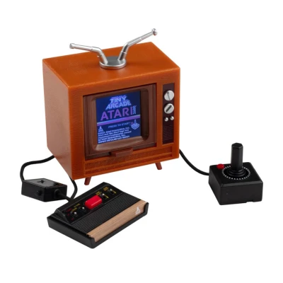 A mini Atari arcade console with a retro wooden TV design, a joystick, and a controller, compact for Aries men to enjoy competitive gaming on the go while seeking victory.