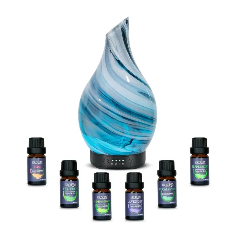 Elegant Aromatherapy Diffuser Kit with a blue glass design and essential oils. A soothing gift for Pisces, featuring lavender and other calming scents.