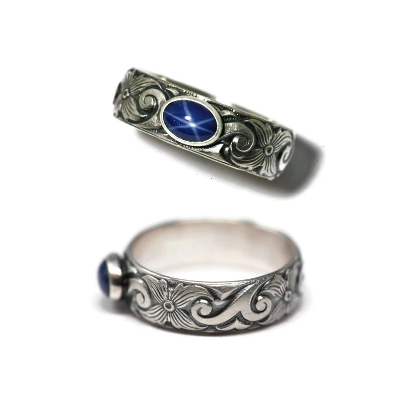 Sterling Silver Wave Ring: A stylish ring with a sapphire setting, perfect for Pisces. Features a lab-grown gem for an ethical, affordable gift.